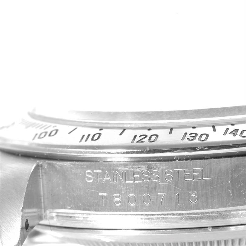 This image shows a close-up of the bezel and case side of a Rolex Daytona 16520 Men's Stainless Steel Black Dial 16520 Men's Stainless Steel Black Dial watch, highlighting the stainless steel engraving.