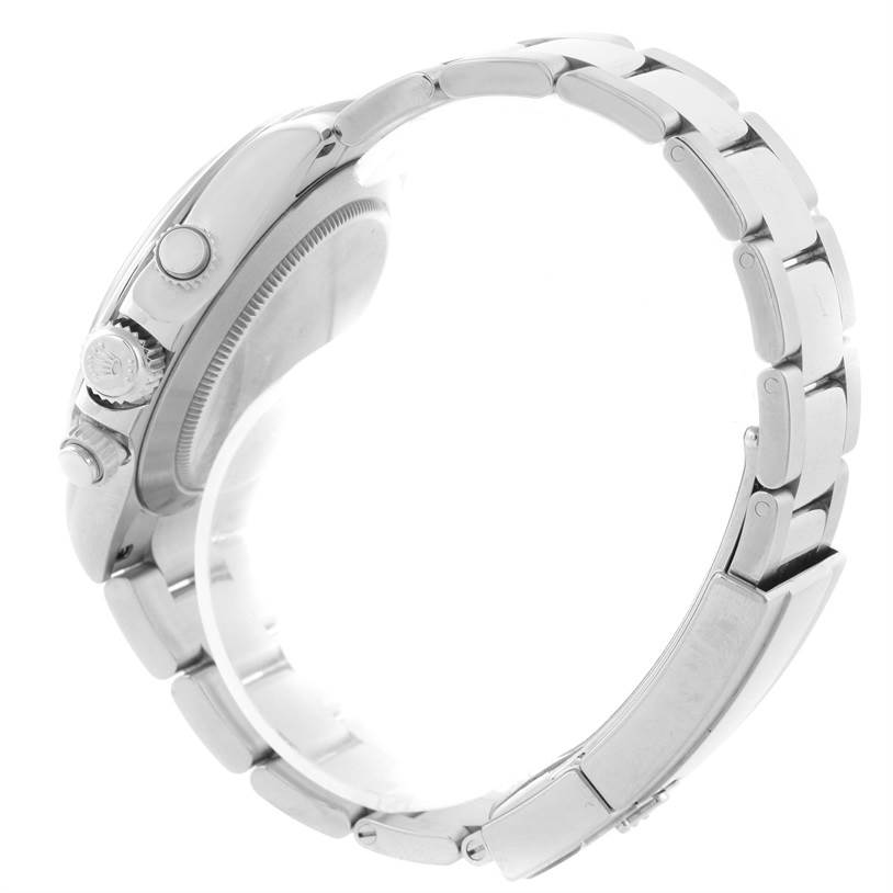 The image shows a side view of a Rolex Daytona 116520 Men's Stainless Steel Black Dial 116520 Men's Stainless Steel Black Dial watch, highlighting the crown, pushers, and bracelet links.