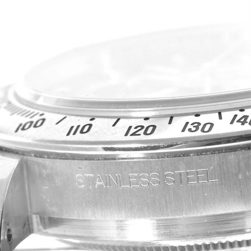 This close-up shows the stainless steel case and bezel with tachymeter markings of a Rolex Daytona 116520 Men's Stainless Steel Black Dial 116520 Men's Stainless Steel Black Dial watch.