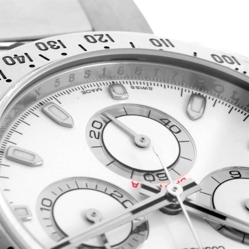 The image shows a close-up of the dial and subdials of a Rolex Daytona 116520 Men's Stainless Steel White Dial 116520 Men's Stainless Steel White Dial, highlighting details like the bezel and indices.