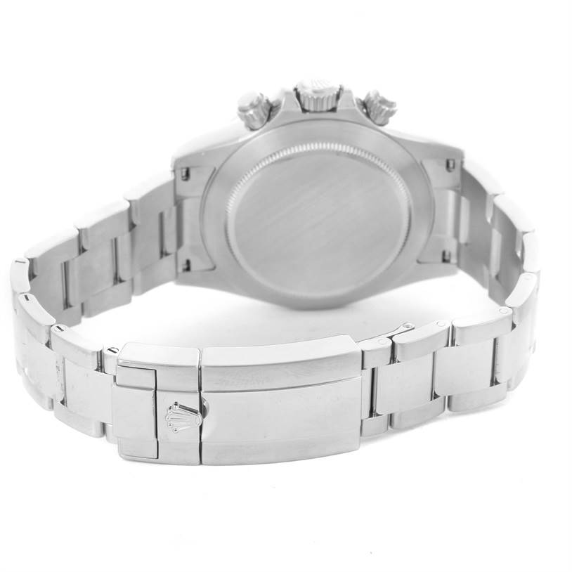 The image shows the back view of a Rolex Daytona 116520 Men
s Stainless Steel White Dial 116520 Men
s Stainless Steel White Dial watch, highlighting the case back and bracelet clasp.