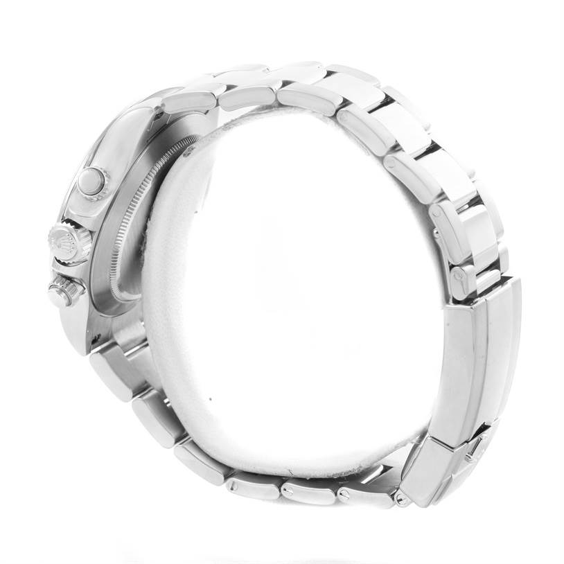 This is a side view of a Rolex Daytona 116520 Men
s Stainless Steel White Dial 116520 Men
s Stainless Steel White Dial, showing the bracelet and the crown with pushers.