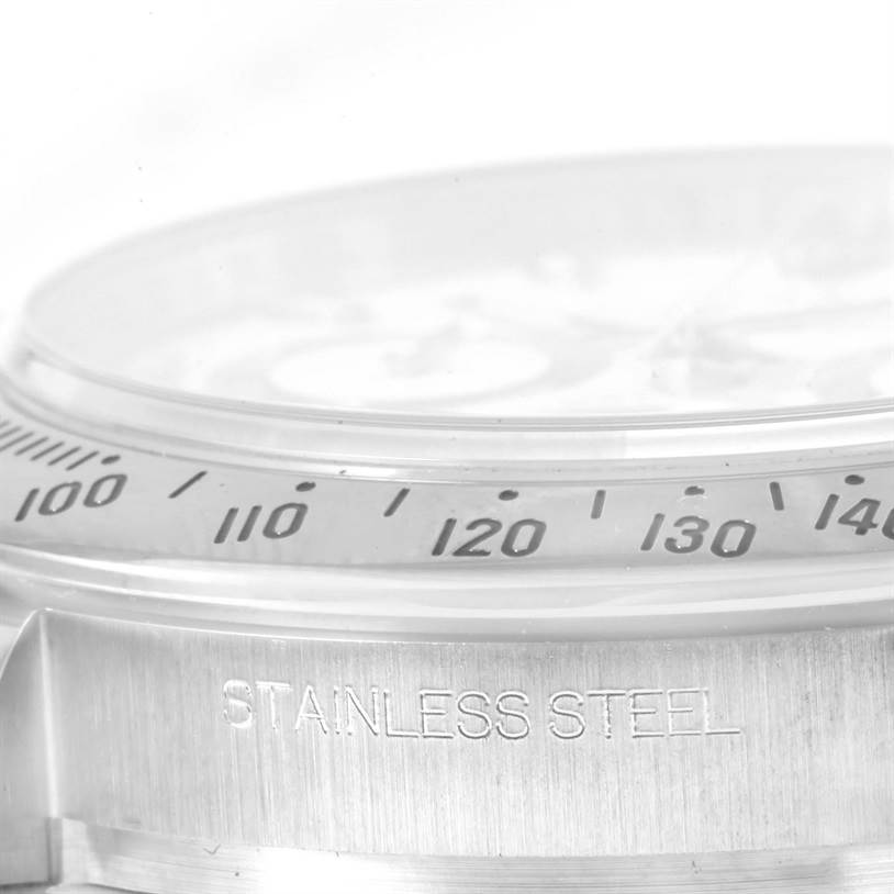 This image shows a close-up of the side and bezel of a Rolex Daytona 116520 Men
s Stainless Steel White Dial 116520 Men
s Stainless Steel White Dial watch, highlighting the stainless steel engraving.