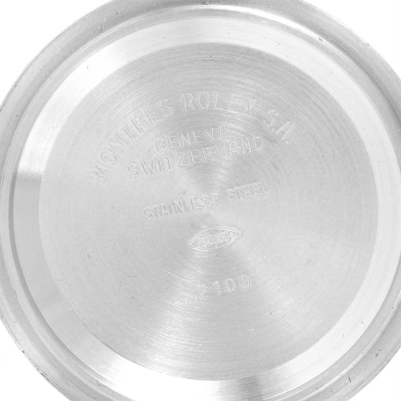 The image shows the inner case back of a Rolex Daytona 116523 Men's Steel and Gold (two tone) Champagne Dial 116523 Men's Steel and Gold (two tone) Champagne Dial watch, displaying engravings and stainless steel material.