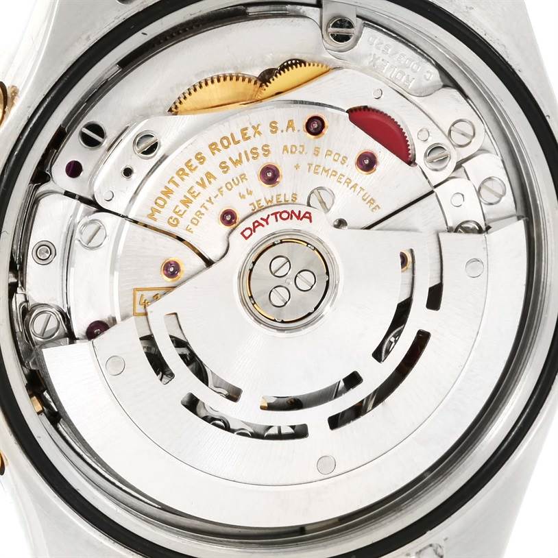 This image shows the movement and internal components of a Rolex Daytona 116523 Men's Steel and Gold (two tone) Champagne Dial 116523 Men's Steel and Gold (two tone) Champagne Dial watch from a close-up rear angle.