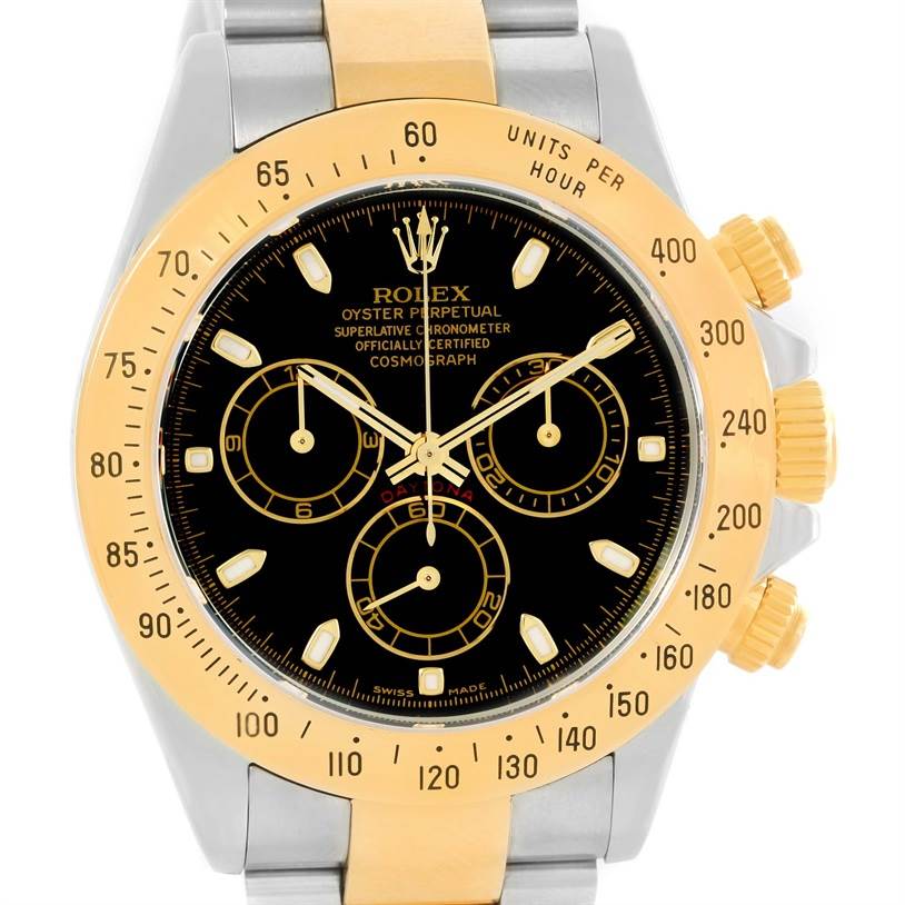 The image shows a frontal view of the Rolex Daytona 116523 Men's Steel and Gold (two tone) Black Dial 116523 Men's Steel and Gold (two tone) Black Dial watch, highlighting its bezel, dial, and chronograph sub-dials.