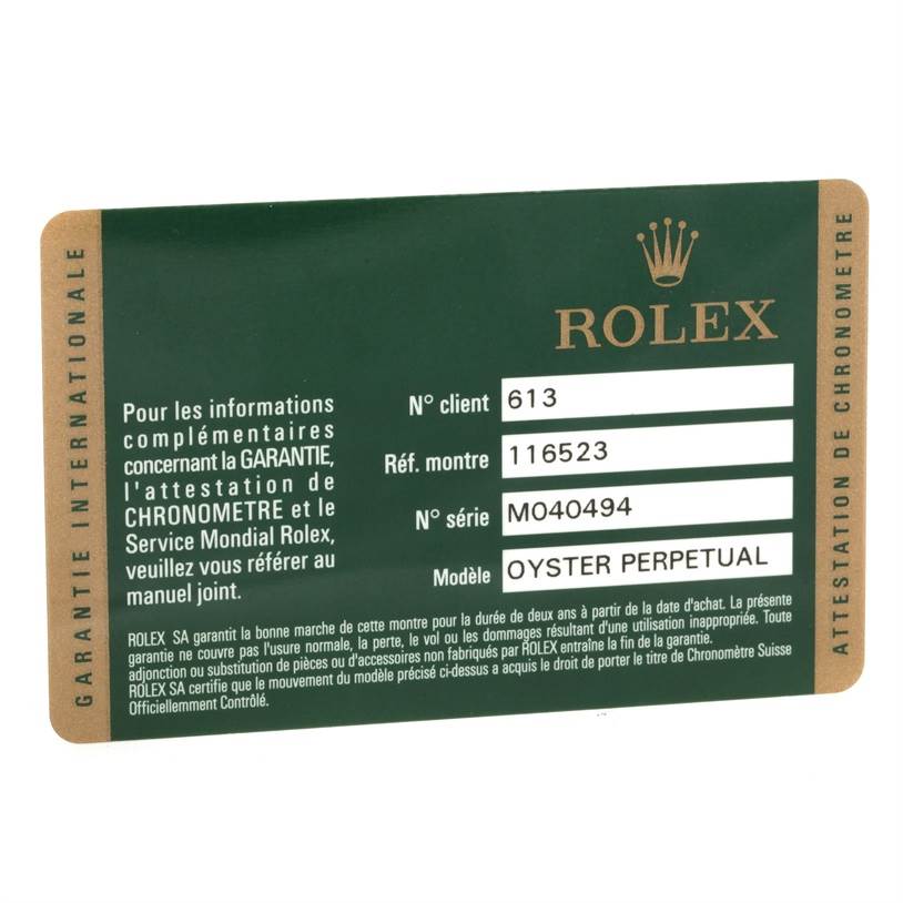 This image shows the international warranty card for a Rolex Daytona 116523 Men's Steel and Gold (two tone) Mother of Pearl Dial 116523 Men's Steel and Gold (two tone) Mother of Pearl Dial model watch, displaying client number, reference number, serial number, and model.