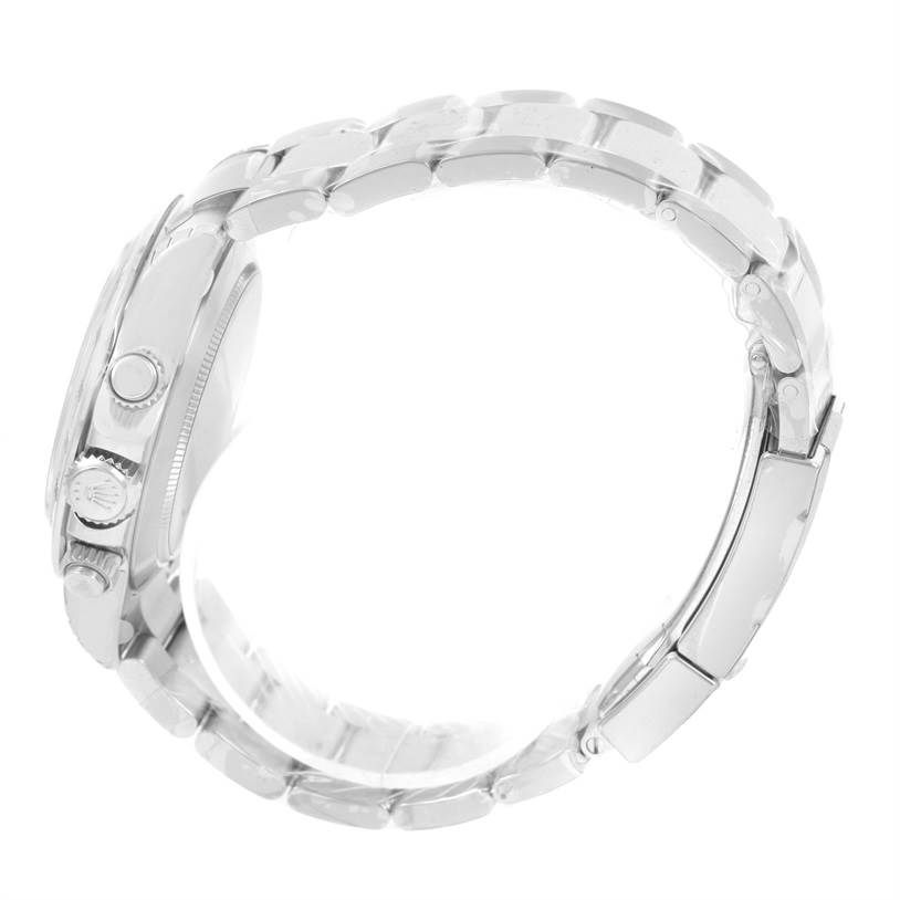 The image shows a Rolex Daytona 116520 Men's Stainless Steel Black Dial 116520 Men's Stainless Steel Black Dial watch from a side profile, highlighting the crown, pushers, and bracelet.