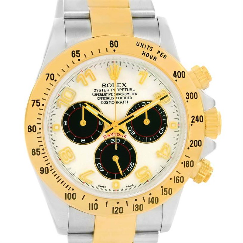 The image shows a frontal view of a Rolex Daytona watch, featuring a yellow-gold bezel, three subdials, and a two-tone bracelet.