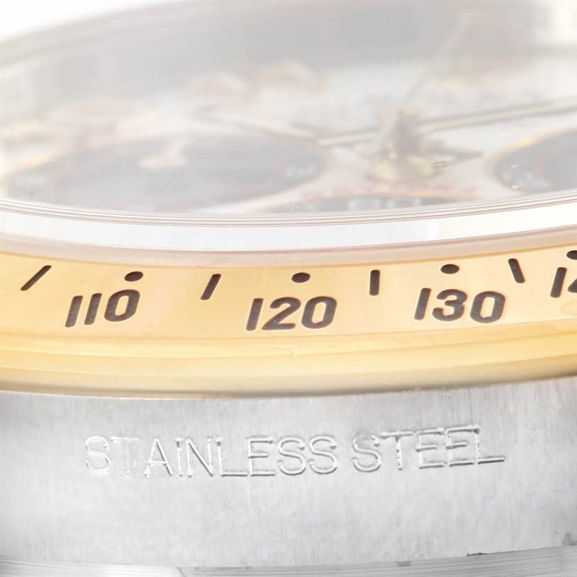 The image shows a close-up side view of the bezel and case with "STAINLESS STEEL" engraving on the Rolex Daytona 116523 Men's Steel and Gold (two tone) White Dial 116523 Men's Steel and Gold (two tone) White Dial watch.