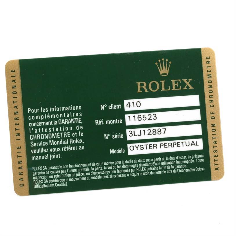 This image shows a green and gold Rolex warranty card for an Oyster Perpetual Daytona watch model.