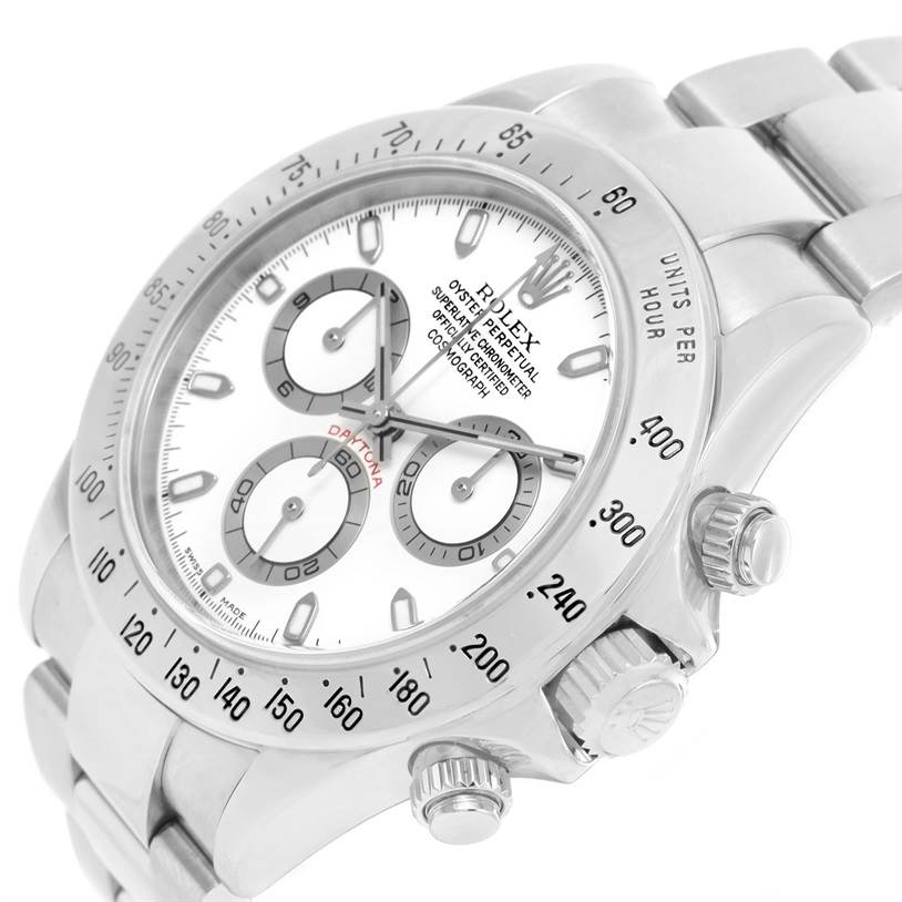 The image shows a Rolex Daytona 116520 Men's Stainless Steel White Dial 116520 Men's Stainless Steel White Dial watch at an angle highlighting its bezel, dial, pushers, and part of the bracelet.