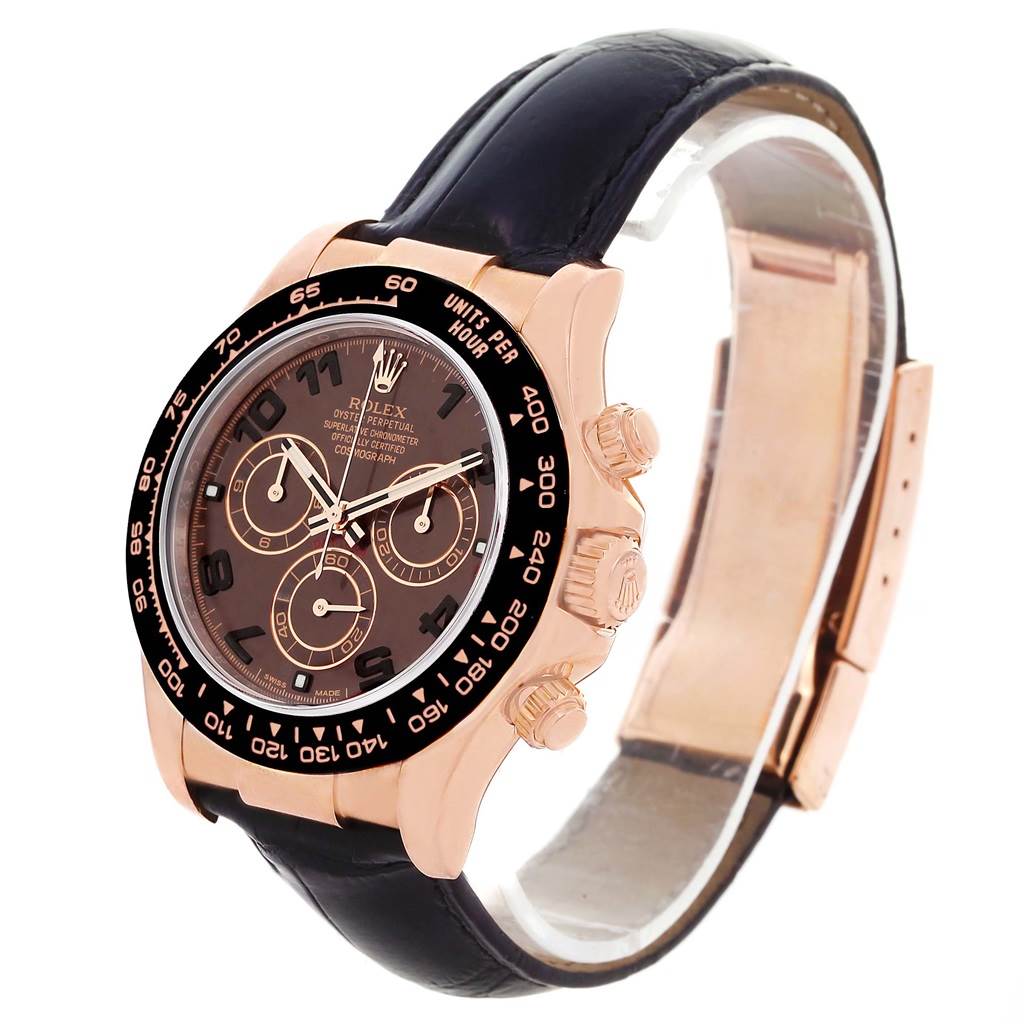 This Rolex Daytona 116515LN Men
s Rose Gold Brown Dial 116515LN Men
s Rose Gold Brown Dial watch is shown from a front-right angle, highlighting its face, chronograph buttons, and leather strap.