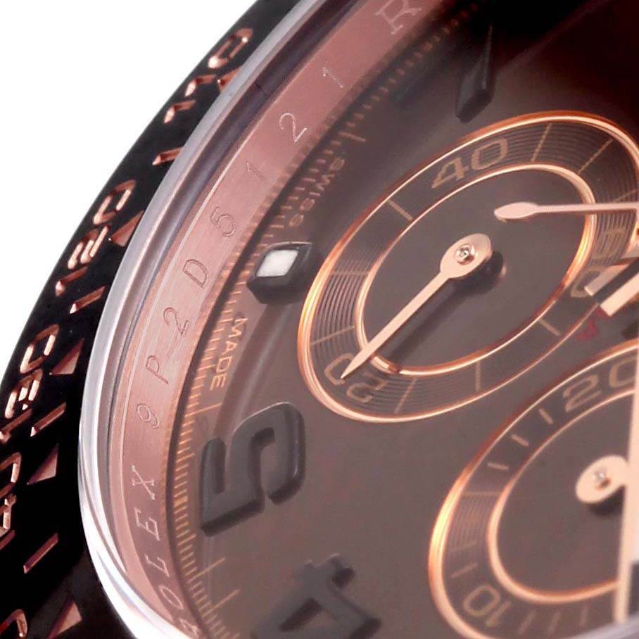 This close-up image of a Rolex Daytona 116515LN Men
s Rose Gold Brown Dial 116515LN Men
s Rose Gold Brown Dial watch shows part of the dial, bezel, and subdials.