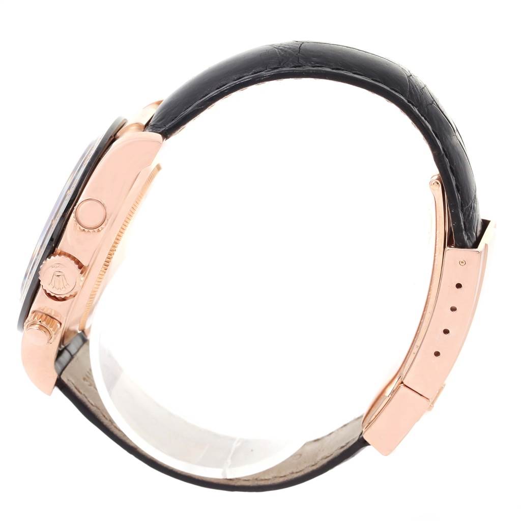 The image shows a side view of a Rolex Daytona 116515LN Men
s Rose Gold Brown Dial 116515LN Men
s Rose Gold Brown Dial watch, highlighting the crown, pushers, and black leather strap.