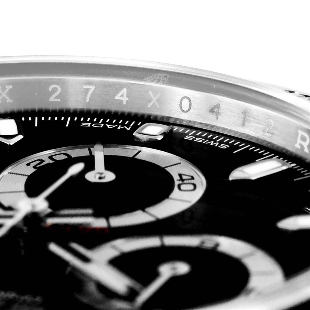 This close-up angle of the Rolex Daytona 116500 Men's Stainless Steel Black Dial 116500 Men's Stainless Steel Black Dial watch shows part of the bezel, chronograph subdials, and hour markers.