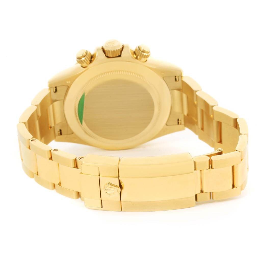 The image shows the back view of a gold Rolex Daytona 116528 Men's Yellow Gold Black Dial 116528 Men's Yellow Gold Black Dial watch, highlighting the clasp, band, and case back.