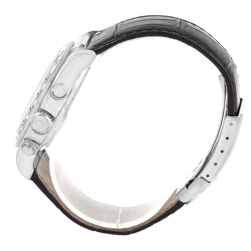 The image shows a side view of a Rolex Daytona 116519 Men's White Gold White Dial 116519 Men's White Gold White Dial watch, highlighting the case, crown, chronograph pushers, and a black leather strap.