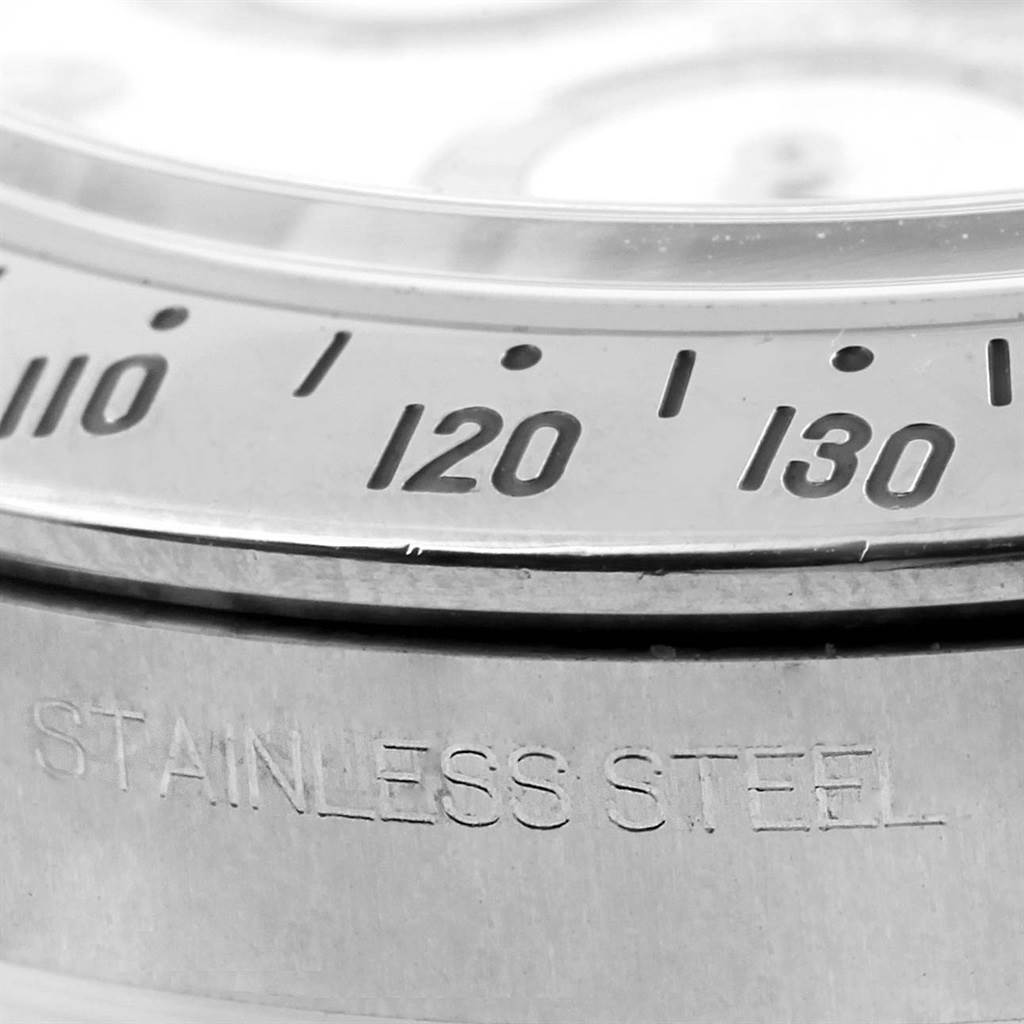 This image shows a close-up of the bezel and engraving on the stainless steel case of a Rolex Daytona 116520 Men
s Stainless Steel White Dial 116520 Men
s Stainless Steel White Dial watch.