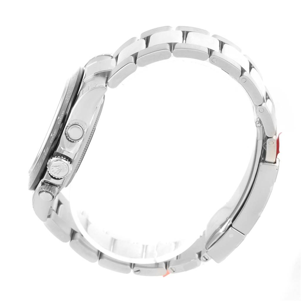 The image shows the side profile of a Rolex Daytona 116500 Men's Stainless Steel Black Dial 116500 Men's Stainless Steel Black Dial watch, highlighting its case, crown, pushers, and bracelet.