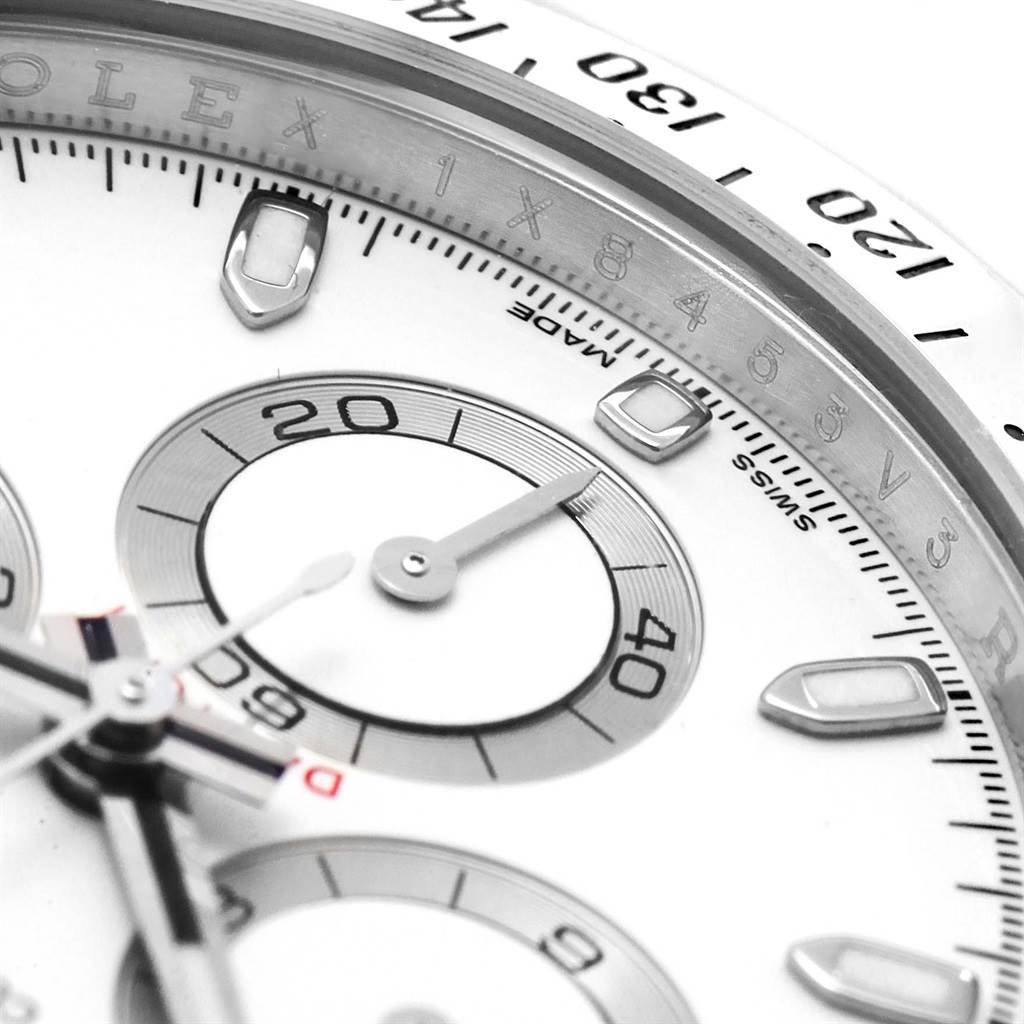 This close-up image of a Rolex Daytona 116520 Men's Stainless Steel White Dial 116520 Men's Stainless Steel White Dial watch shows its subdials, hour markers, and part of the bezel from an angled shot.
