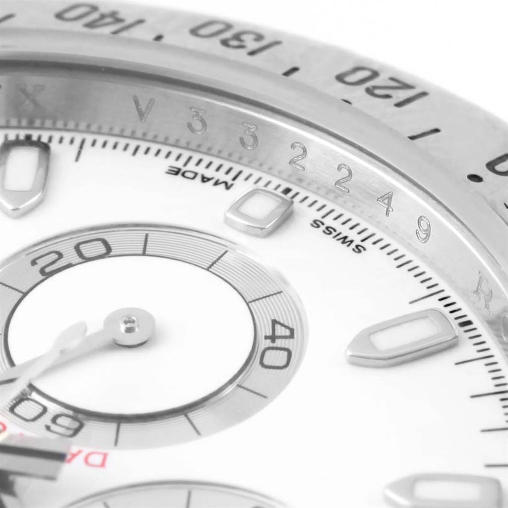 The image shows a close-up of the dial and part of the bezel of a Rolex Daytona 116520 Men's Stainless Steel White Dial 116520 Men's Stainless Steel White Dial watch.