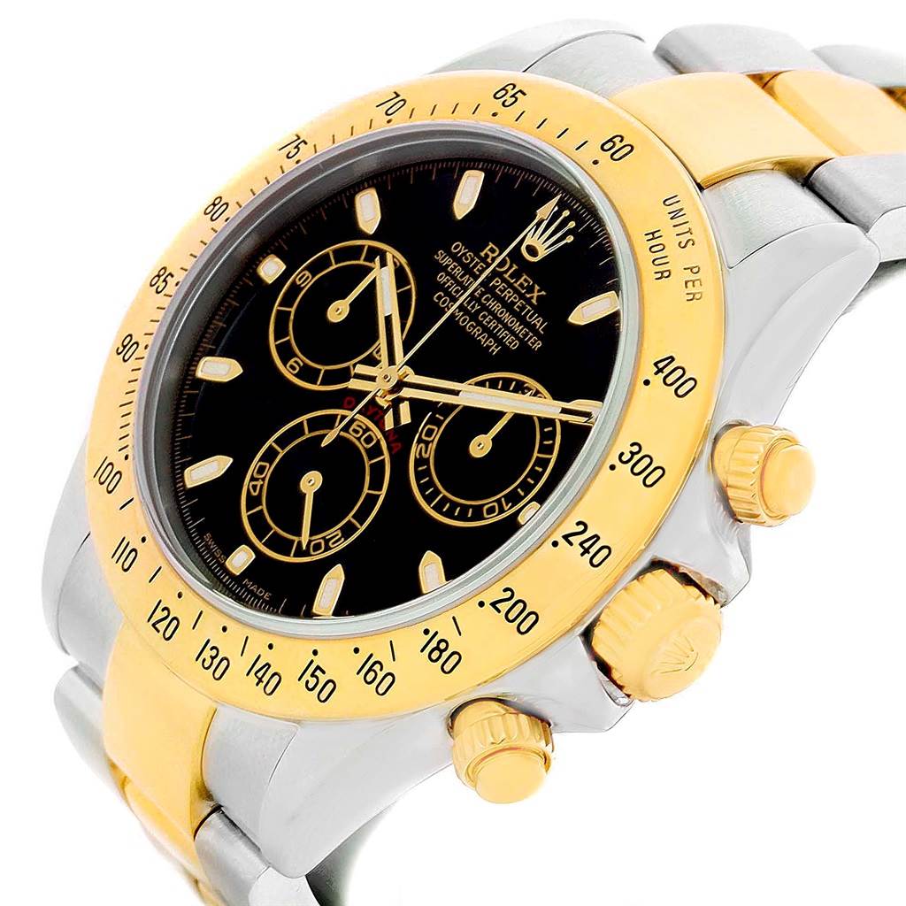 This image shows a close-up angle of the face, bezel, and part of the bracelet of a Rolex Daytona 116523 Men's Steel and Gold (two tone) Black Dial 116523 Men's Steel and Gold (two tone) Black Dial watch.