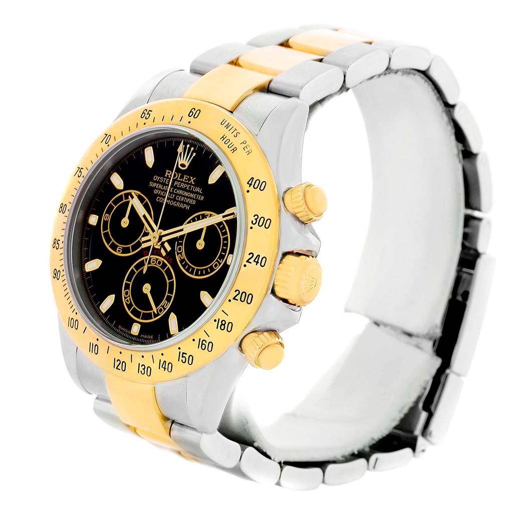 The image shows a Rolex Daytona 116523 Men's Steel and Gold (two tone) Black Dial 116523 Men's Steel and Gold (two tone) Black Dial watch angled to display its face, bezel, crown, and bracelet in a bi-colored design.