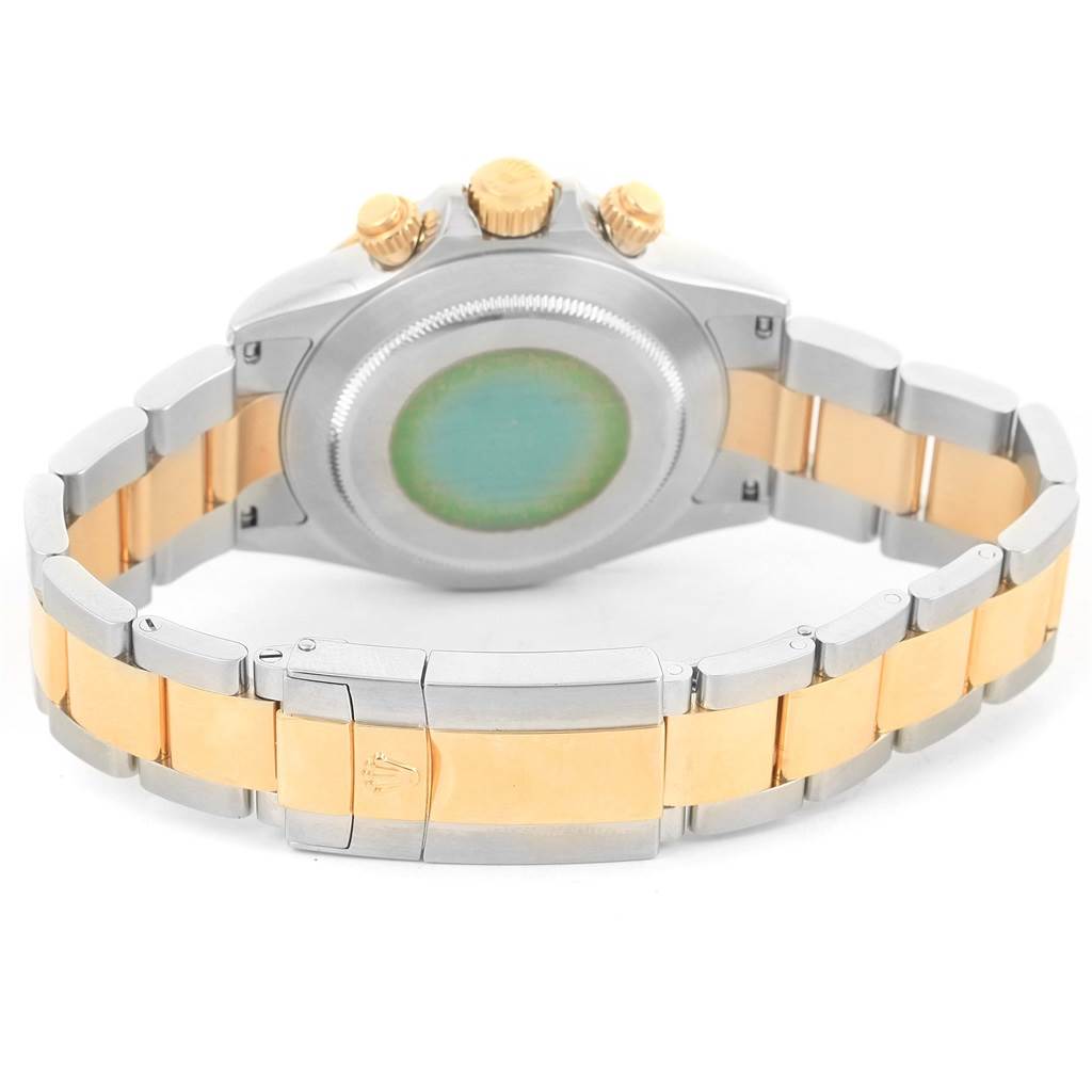 This image shows the back and bracelet of a Rolex Daytona 116523 Men's Steel and Gold (two tone) Black Dial 116523 Men's Steel and Gold (two tone) Black Dial watch, focusing on the clasp and the caseback.