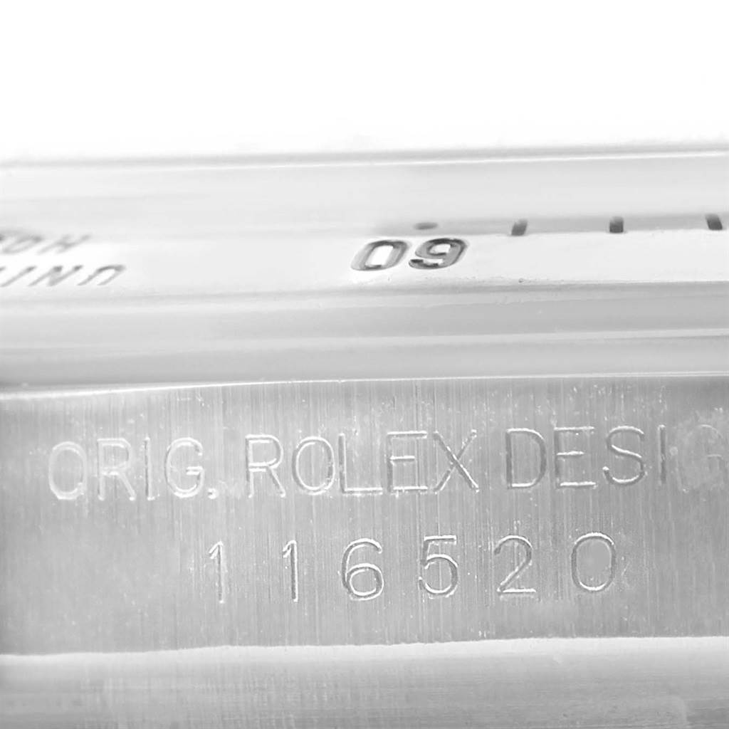 The image shows a close-up of the model number "116520" and "ORIG. ROLEX DESIGN" engraving on a Rolex Daytona 116520 Men's Stainless Steel Black Dial 116520 Men's Stainless Steel Black Dial watch.