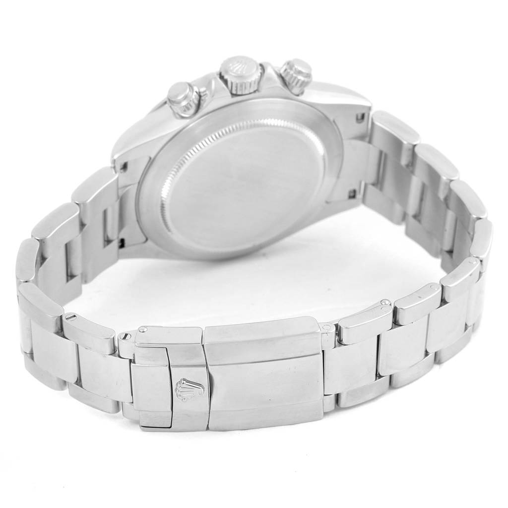 The image shows the back case and bracelet of a Rolex Daytona 116520 Men's Stainless Steel Black Dial 116520 Men's Stainless Steel Black Dial watch, including its clasp and chronograph push buttons.