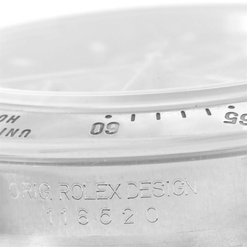 The image shows a close-up view of the bezel and engraving on the side of a Rolex Daytona 116520 Men's Stainless Steel Black Dial 116520 Men's Stainless Steel Black Dial watch, featuring "ORIG. ROLEX DESIGN" and the model number 116520.