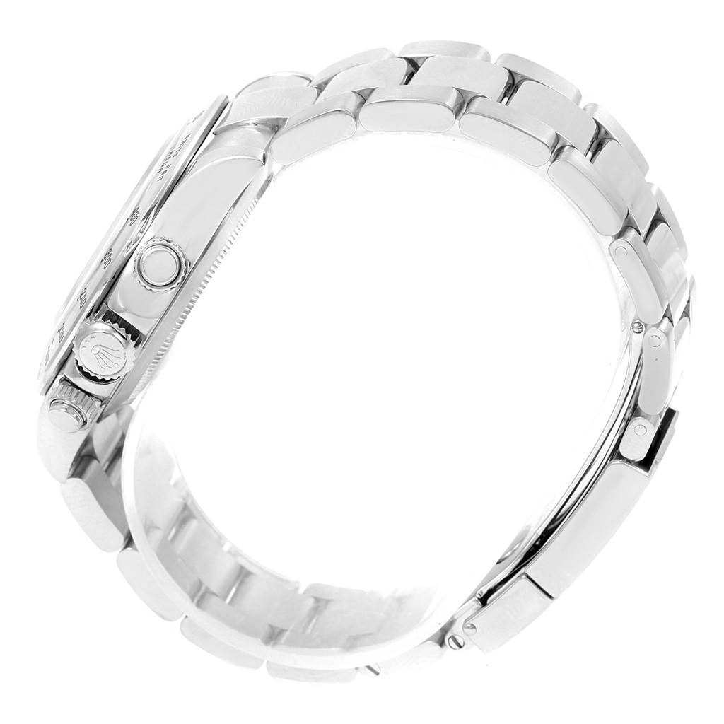 The image shows a side view of a Rolex Daytona 116520 Men's Stainless Steel White Dial 116520 Men's Stainless Steel White Dial model watch, highlighting its metallic bracelet and side buttons.