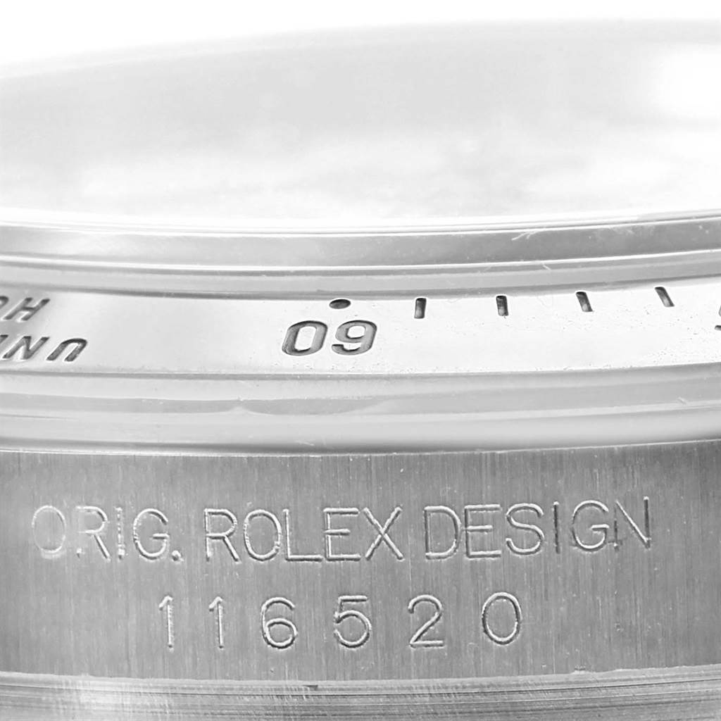 The image shows a close-up of the side case and bezel of a Rolex Daytona 116520 Men's Stainless Steel White Dial 116520 Men's Stainless Steel White Dial, displaying the model number 116520.