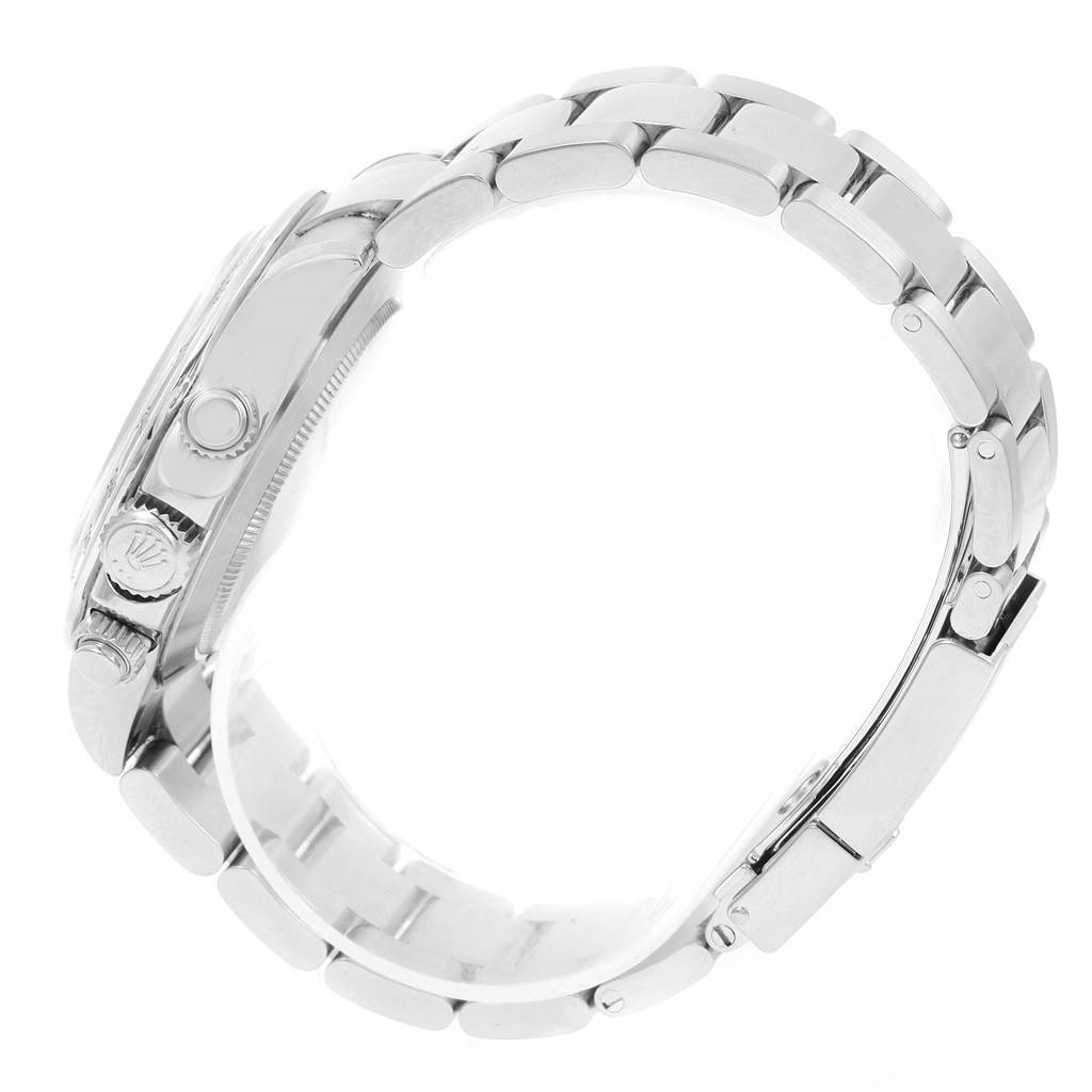 This side view of the Rolex Daytona 116520 Men's Stainless Steel Black Dial 116520 Men's Stainless Steel Black Dial watch displays the crown, pushers, and part of the bracelet.