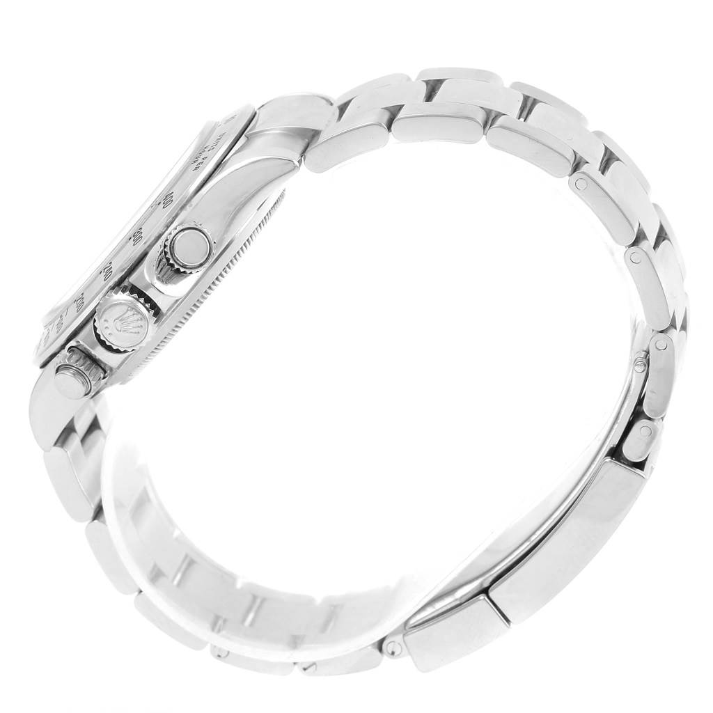 The image shows a side view of a Rolex Daytona 116520 Men's Stainless Steel Black Dial 116520 Men's Stainless Steel Black Dial watch, highlighting the case, crown, pushers, and part of the bracelet.