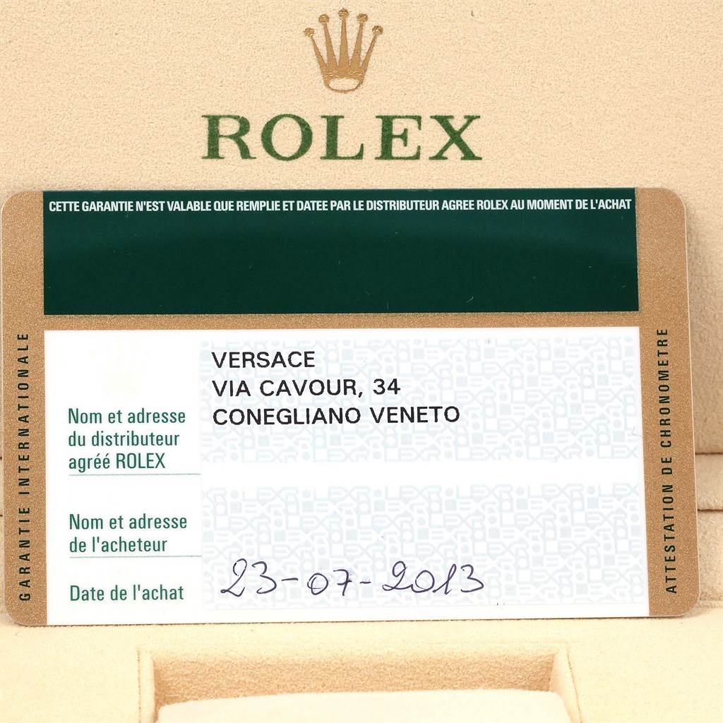 This image shows the warranty card and holder for a Rolex Daytona 116520 Men's Stainless Steel White Dial 116520 Men's Stainless Steel White Dial watch.