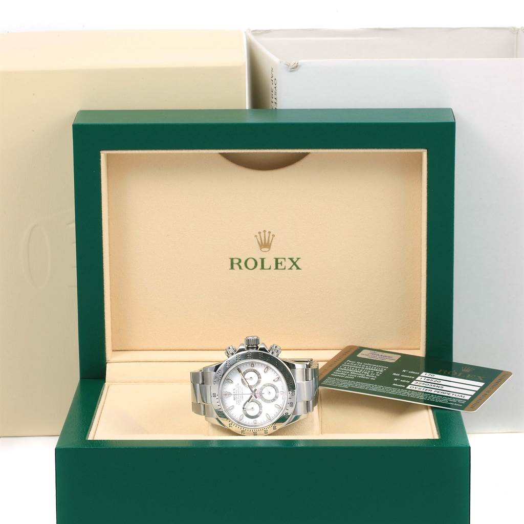 The Rolex Daytona 116520 Men's Stainless Steel White Dial 116520 Men's Stainless Steel White Dial watch is shown front-facing in its green box, along with its authenticity card.