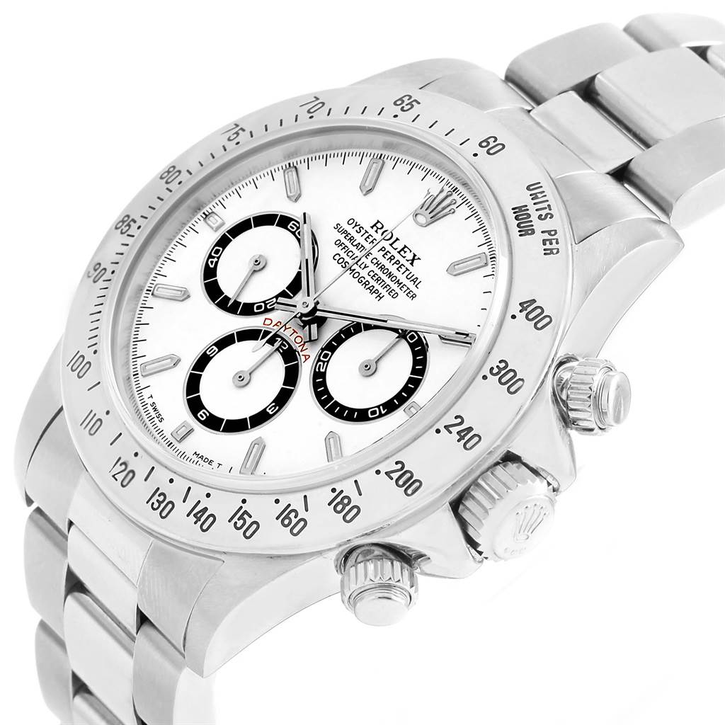 The image shows a close-up angled view of a Rolex Daytona 16520 Men
s Stainless Steel White Dial 16520 Men
s Stainless Steel White Dial watch, highlighting its face, bezel, and pushers.