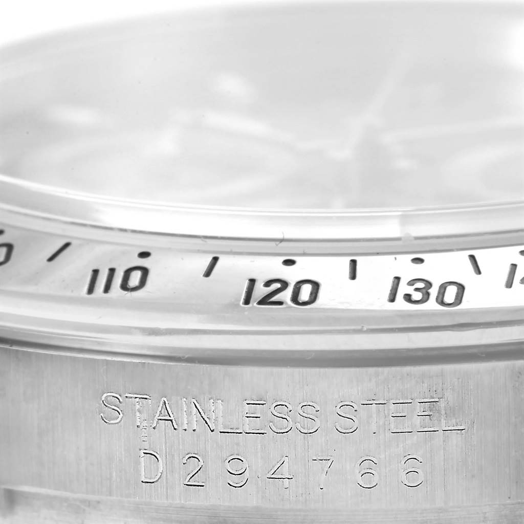 This image shows a close-up of the bezel and stainless steel case with the serial number of a Rolex Daytona 116520 Men's Stainless Steel Black Dial 116520 Men's Stainless Steel Black Dial watch.