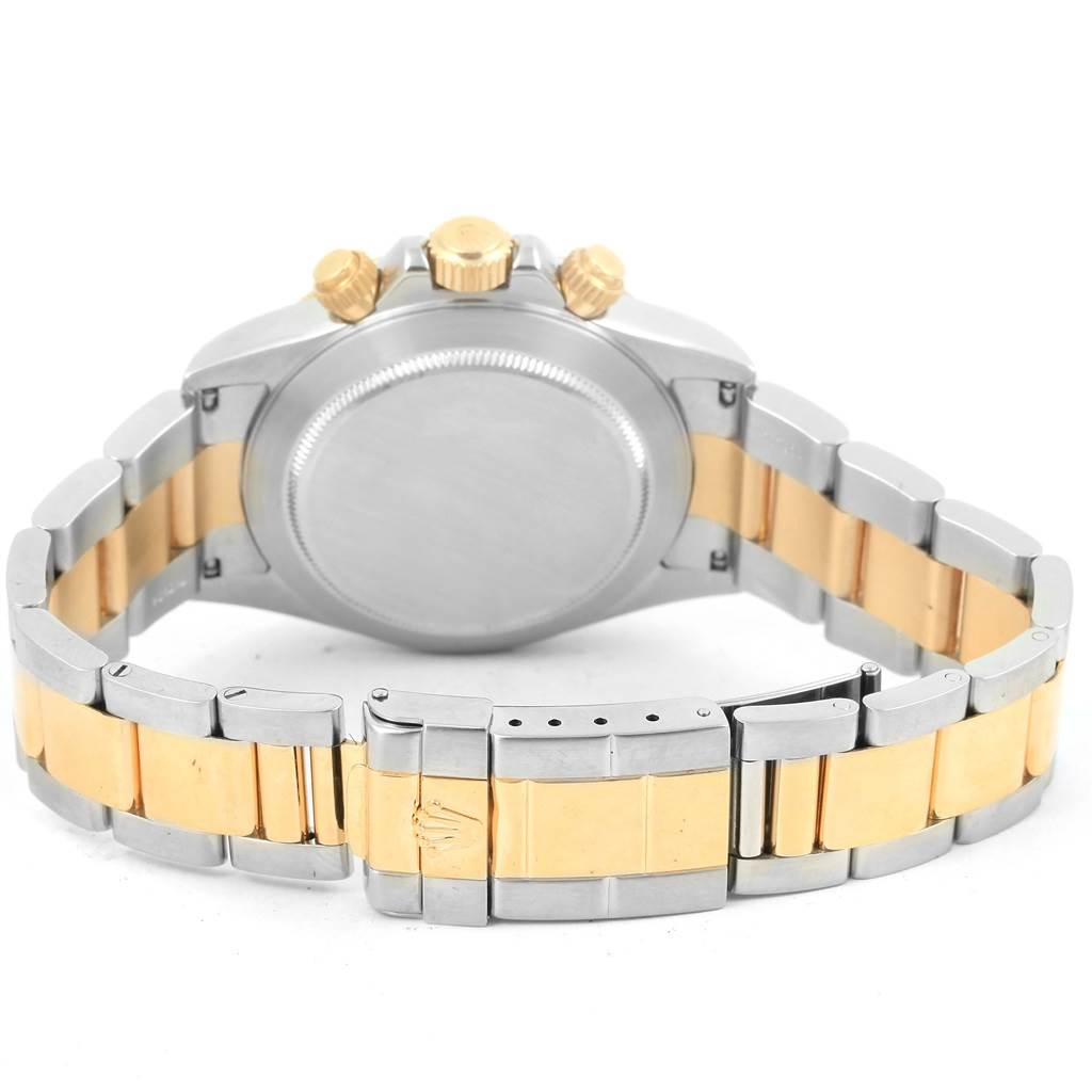 The image shows the back side and bracelet of a Rolex Daytona 16523 Men's Steel and Gold (two tone) Black Dial 16523 Men's Steel and Gold (two tone) Black Dial watch, highlighting its two-tone metal design and clasp.