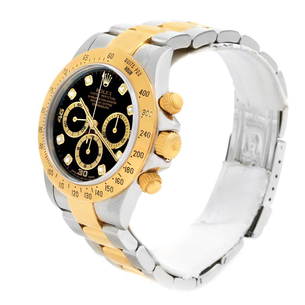The Rolex Daytona 16523 Men's Steel and Gold (two tone) Black Dial 16523 Men's Steel and Gold (two tone) Black Dial watch is shown at a three-quarter angle, highlighting its face, bezel, crown, and bracelet.