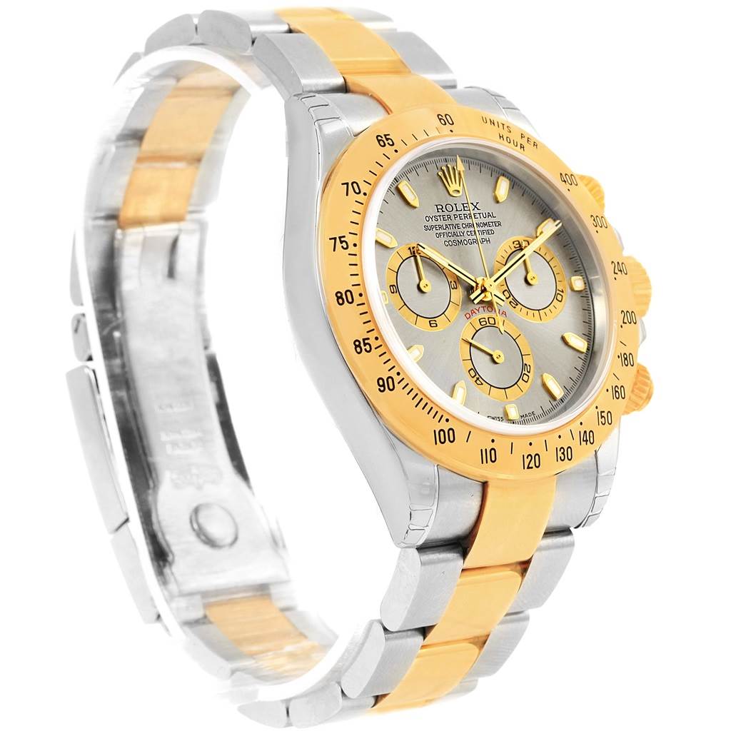 The image shows a side angle view of a Rolex Daytona 116523 Men's Steel and Gold (two tone) Grey Dial 116523 Men's Steel and Gold (two tone) Grey Dial watch, highlighting its gold bezel, dial, and two-tone bracelet.