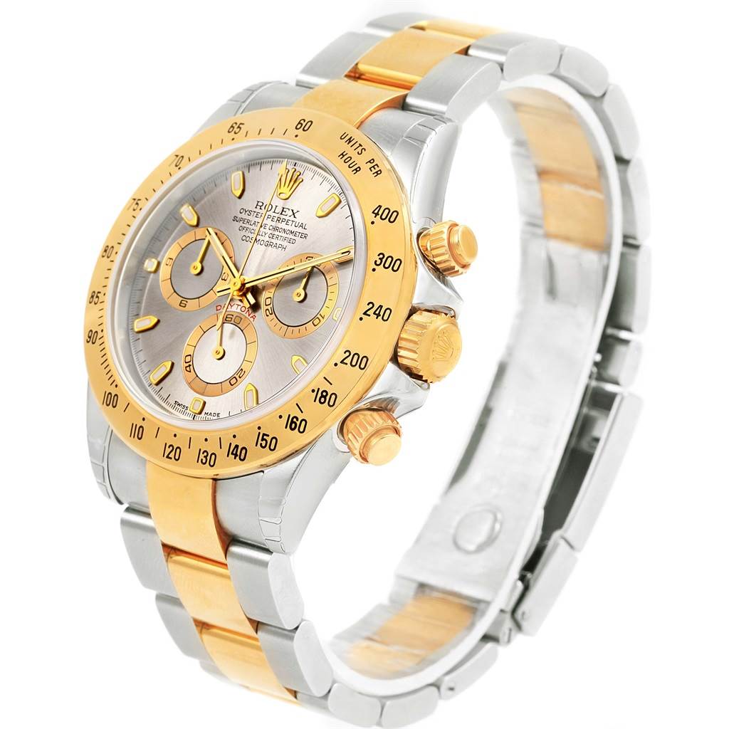 The image shows a Rolex Daytona 116523 Men's Steel and Gold (two tone) Grey Dial 116523 Men's Steel and Gold (two tone) Grey Dial watch at a front-right angle, highlighting its dial, bezel, pushers, and bracelet.