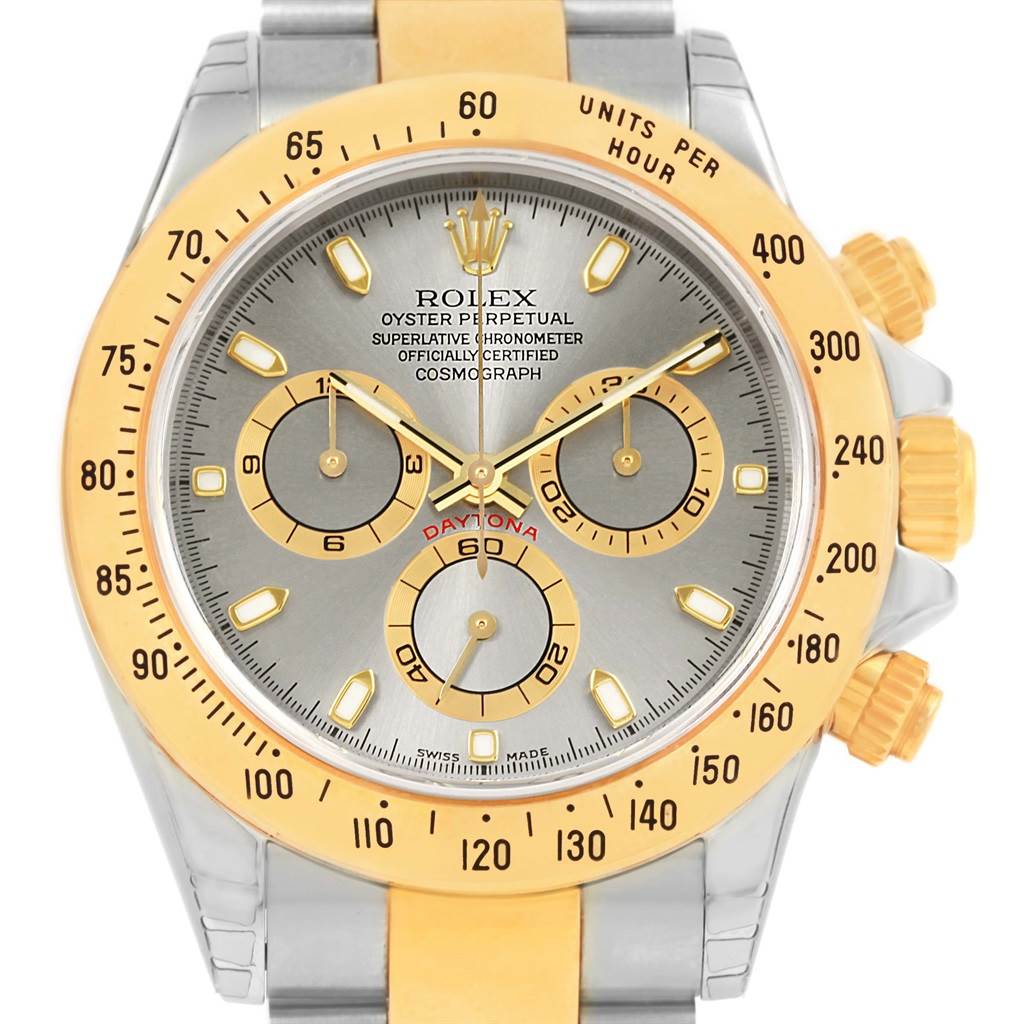The image shows the front view of a Rolex Daytona 116523 Men's Steel and Gold (two tone) Grey Dial 116523 Men's Steel and Gold (two tone) Grey Dial watch, highlighting the bezel, dial, hands, and subdials.