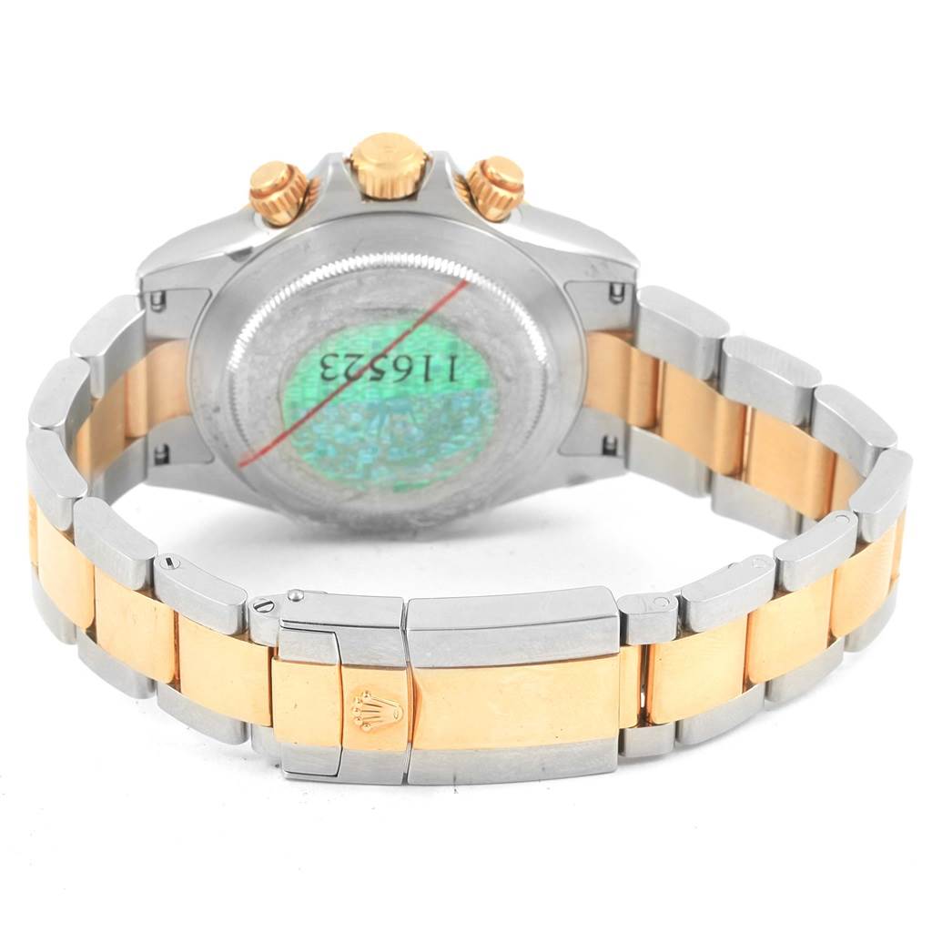 The image shows the back view of a Rolex Daytona 116523 Men's Steel and Gold (two tone) Grey Dial 116523 Men's Steel and Gold (two tone) Grey Dial watch, highlighting the bracelet, clasp, and caseback.