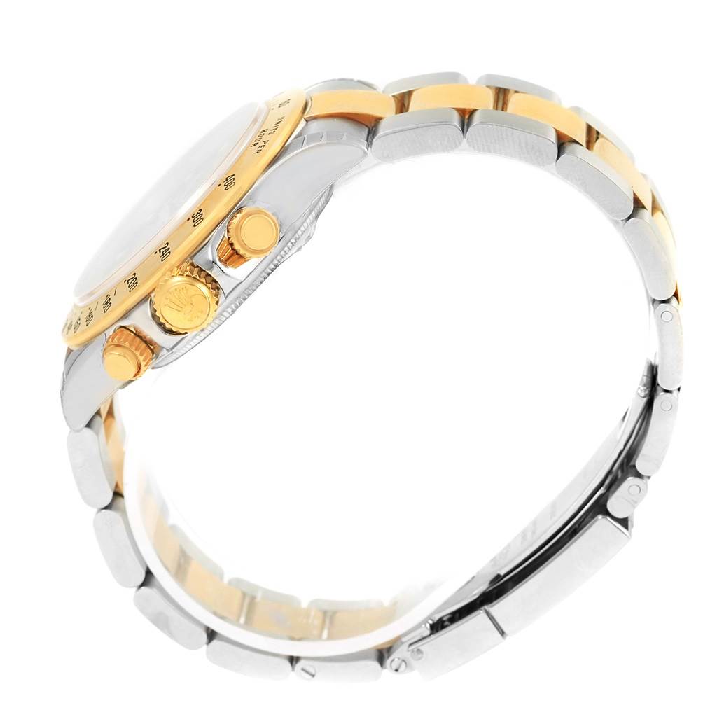 The image shows a side view of a Rolex Daytona 116523 Men's Steel and Gold (two tone) Grey Dial 116523 Men's Steel and Gold (two tone) Grey Dial watch, highlighting its two-tone bracelet, crown, and chronograph pushers.