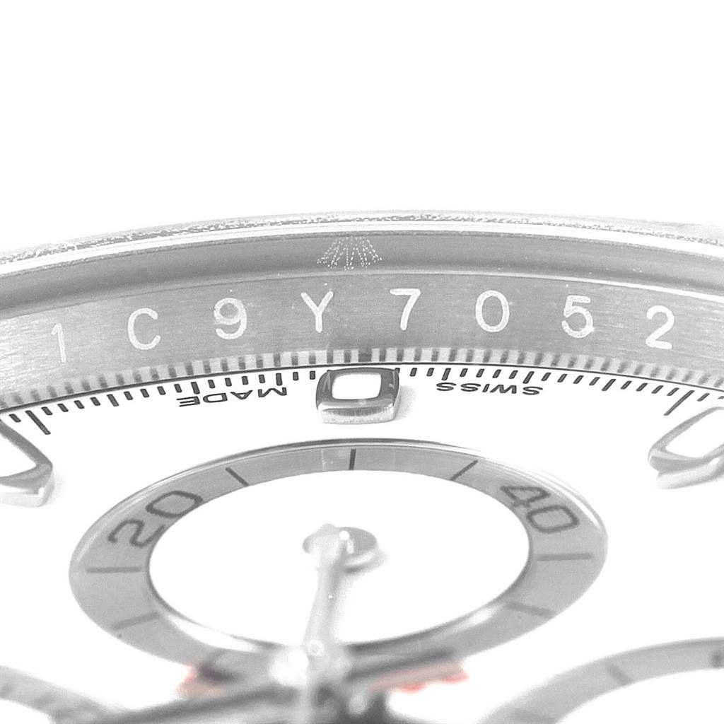 This image shows a close-up angle of the serial number and the partial bezel of a Rolex Daytona 116520 Men
s Stainless Steel White Dial 116520 Men
s Stainless Steel White Dial watch.