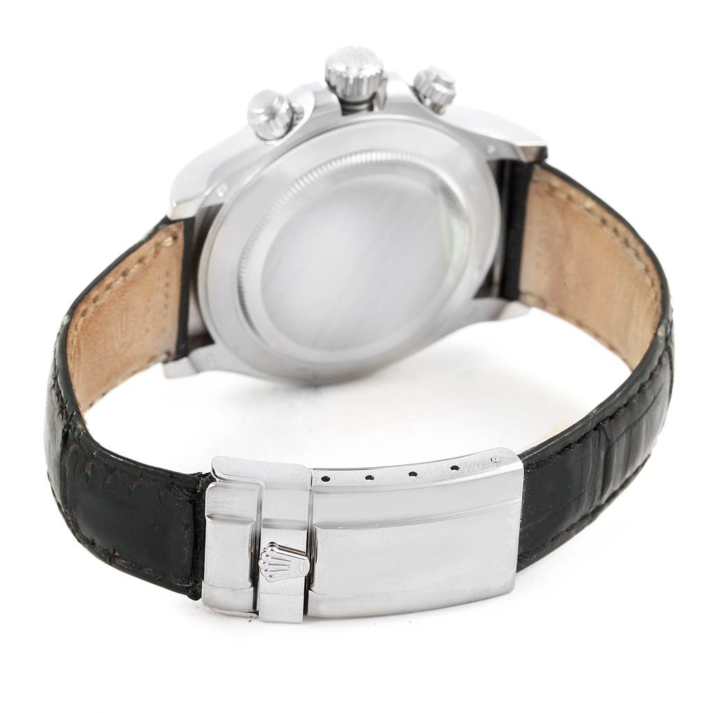 The image shows the back of a Rolex Daytona 116519 Men's White Gold Silver Dial 116519 Men's White Gold Silver Dial watch, focusing on the case back, crown, pushers, and leather strap with clasp.