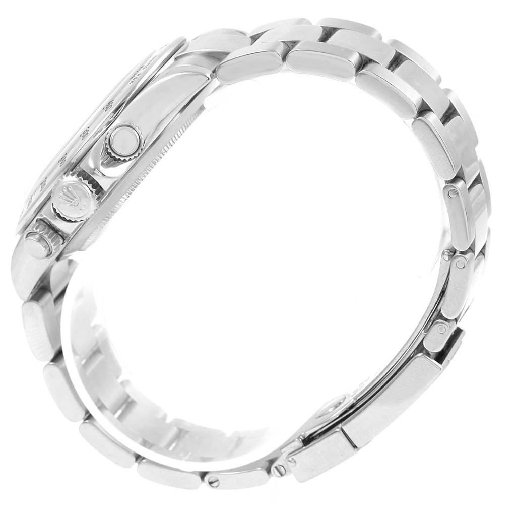 The image shows a side view of a Rolex Daytona 116520 Men
s Stainless Steel White Dial 116520 Men
s Stainless Steel White Dial watch emphasizing the bracelet and crown.